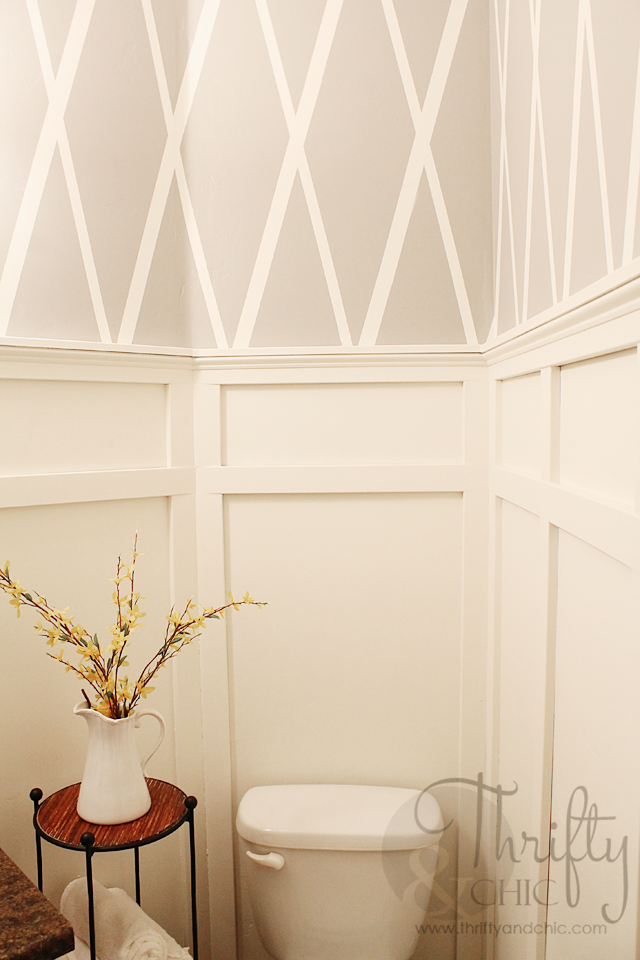 Bathroom makeover with diamond pattern wall using painter's tape and board and batten