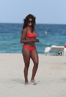 Claudia Jordan looking hot in a red bikini