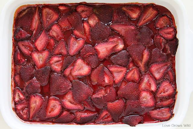 LoveGrowsWild.com | Add this delicious homemade Roasted Strawberry Topping to your ice cream, waffles, or yogurt! Perfect for catching overripe berries just in time!