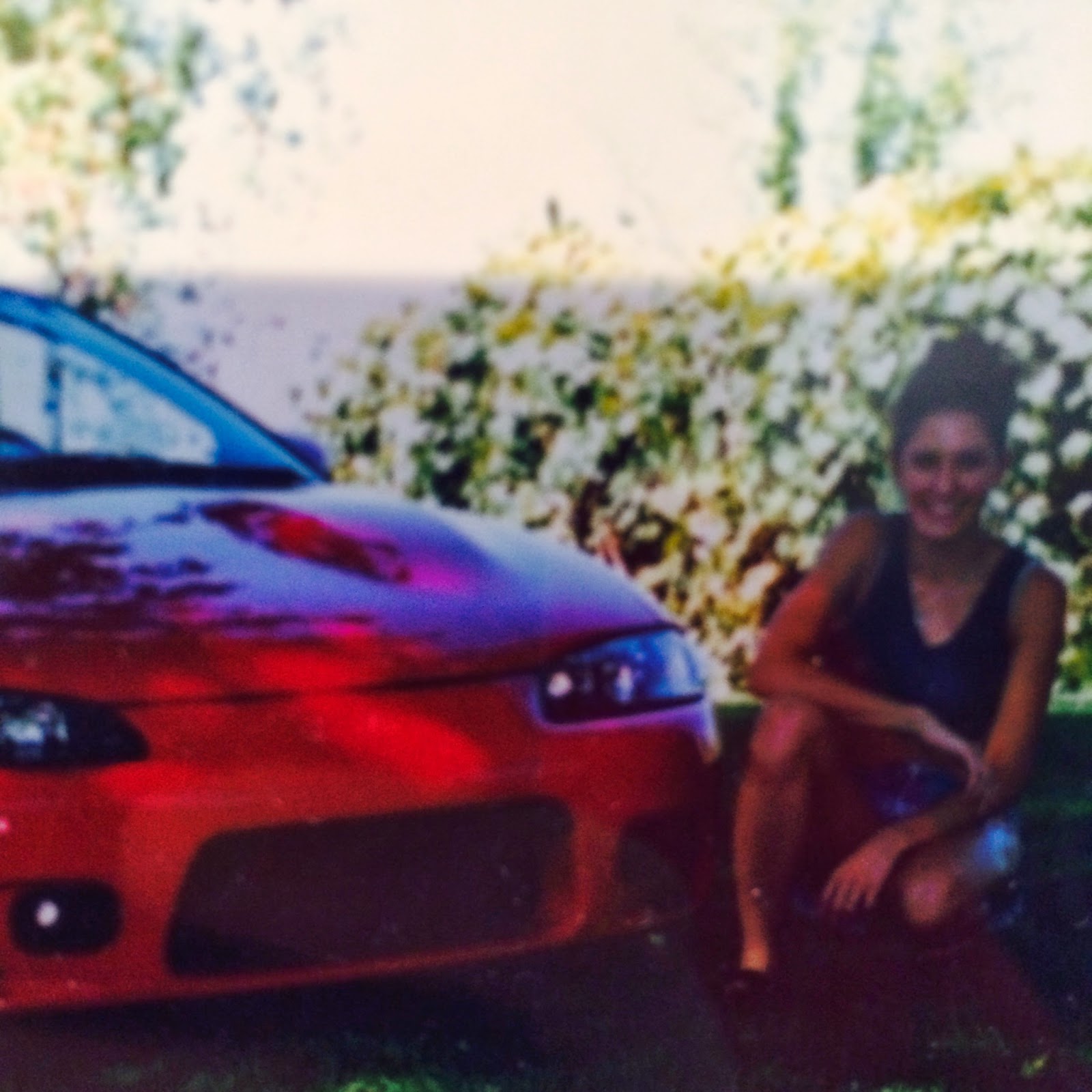 1998 Mitsubishi Eclipse and a girl.