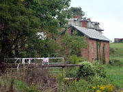 Mudhouse stands on along a desolate road with just the right amount of hills .