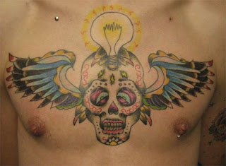 Skull with Wings Tattoo Design on Male Chest