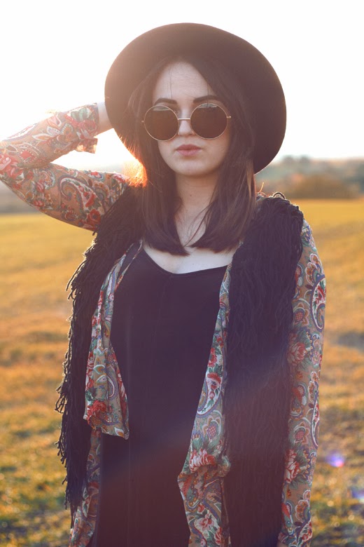 hippy, uk fashion blogger, uk fashion style, zerouv, oversized sunglasses, 70's sunglasses, knitted vest, tassel vest, tassel gilet, fedora, hippie, retro, retro pattern, autumn look, fall look, sunset photo, layering, autumn layering, missguided vellvet swing dress, oasap, cut out boots, office boots