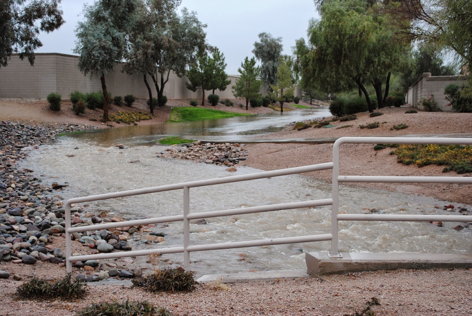 Heavy rains drain through the greenbelts in Phoenix