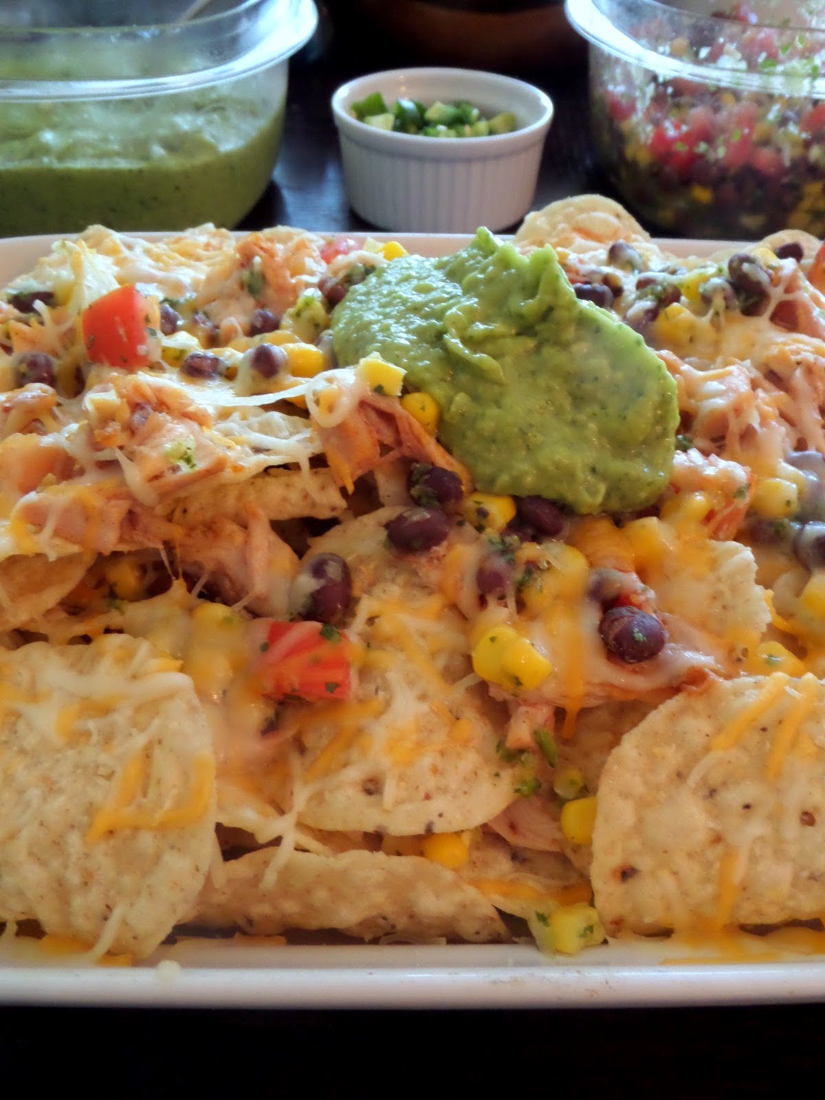 Chicken and Black Bean Salsa Nachos:  Crunchy tortilla chips layered with leftover rotisserie chicken, black bean and corn salsa, and shredded cheese.