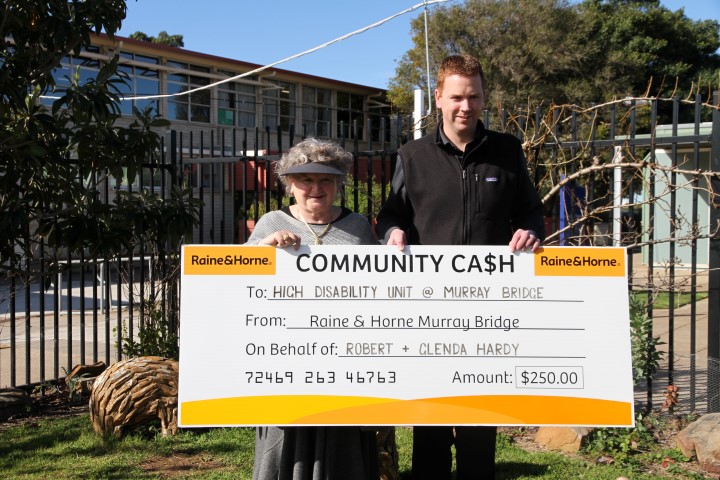 Community cash donated by Raine and Horne Real Estate