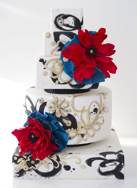 Amazing wedding cake with red and blue flowers from Cake Opera