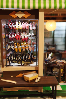 Front window of a miniature Hong Kong shoe shop from the 1960s.