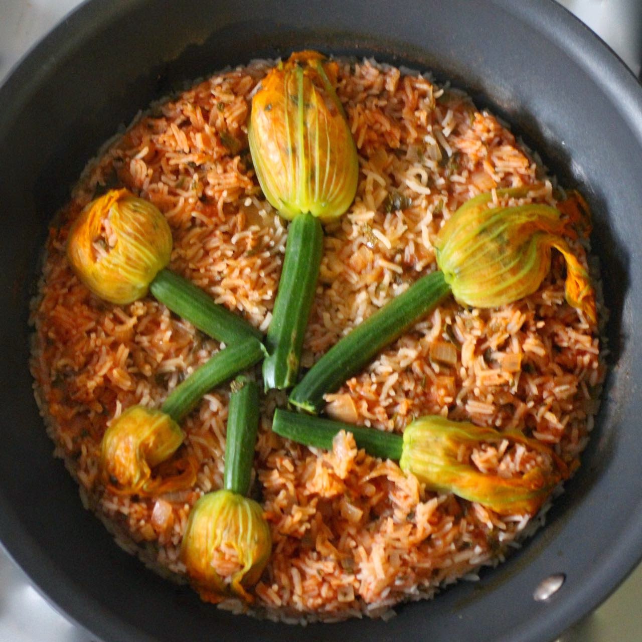 Green Gourmet Giraffe Zucchini flowers with rice, roast pumpkin, and