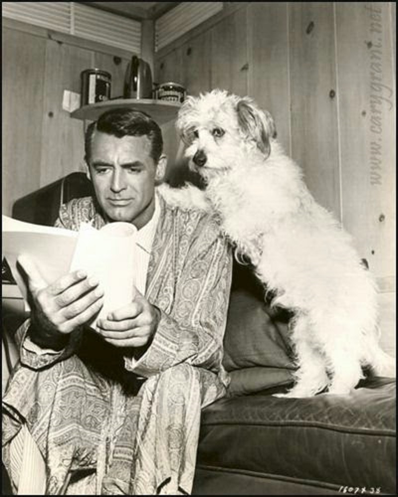 Cary Grant going over a script with his advisor.