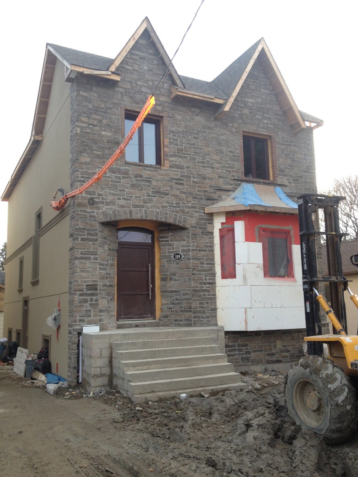 The Reno Coach Passive House Project in Toronto Stone work on Front of