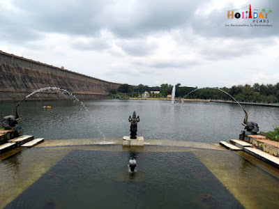 Goddess Lakshmi statue beside the lake boating in brindavan gardens