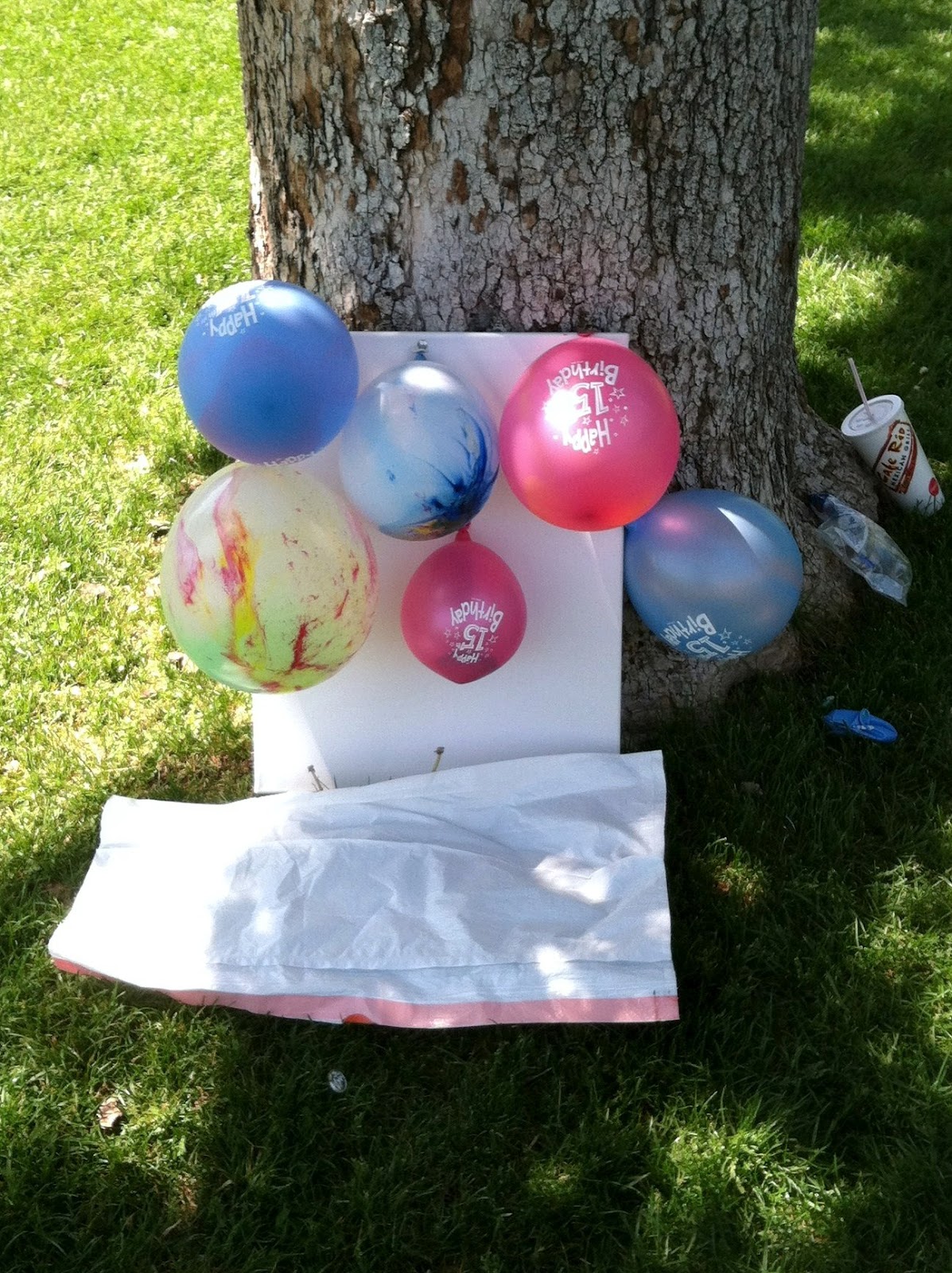 ruhbekuh Throwing darts at balloons filled with paint at Liberty