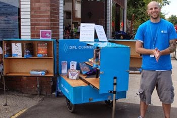 Denver Public Library's Zac Laugheed standing next to one of the library's DPL Connect bikes. Denver Public Library's Zac Laugheed standing next to one of the library's DPL Connect bikes.