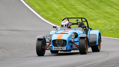 On track at Cadwell Park - great picture showing the orange shocks and wheel rims