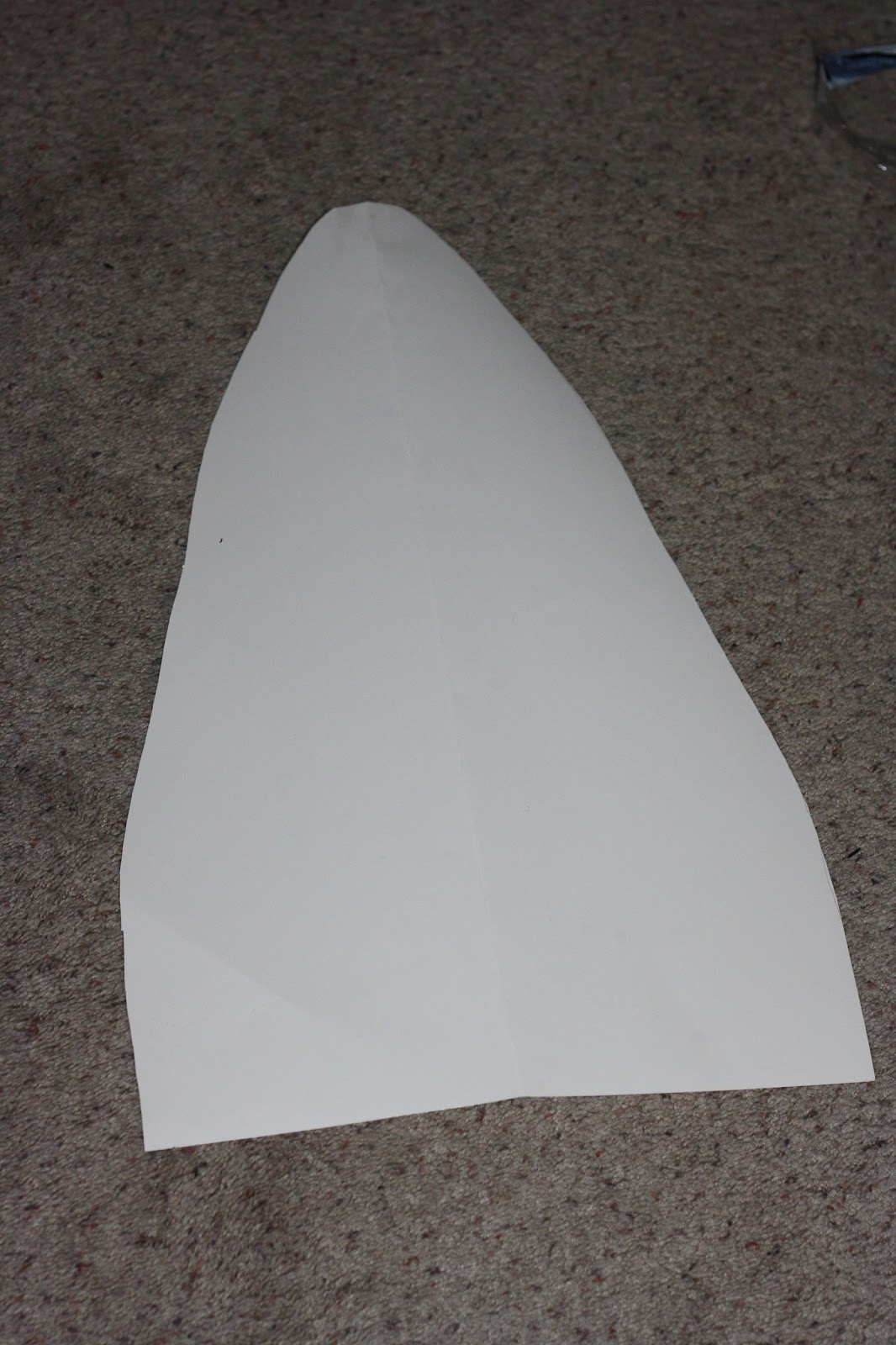 First, if you have a piece of card board or a poster board then free hand on one side of the