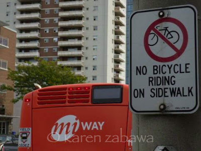 No Cycling on sidewalk sign for City of Mississauga bylaw. Sign says No Cycling on sidewalks in Mississauga.