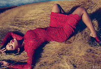 Rihanna in a red dress posing for Vogue magazine 2012