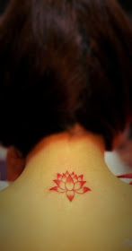 cute lotus flower tattoo under the neck