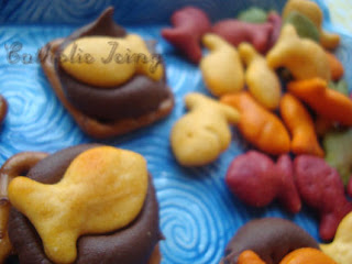 Rainbow Goldfish on pretzels with chocolate