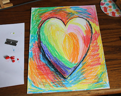 paper batik instruction drawing of a multi colored heart