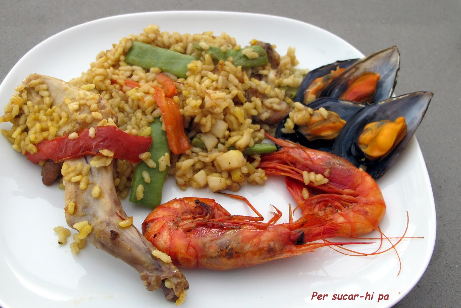 Per sucarhi pa, gastronomía y viajes Paella de conejo y marisco