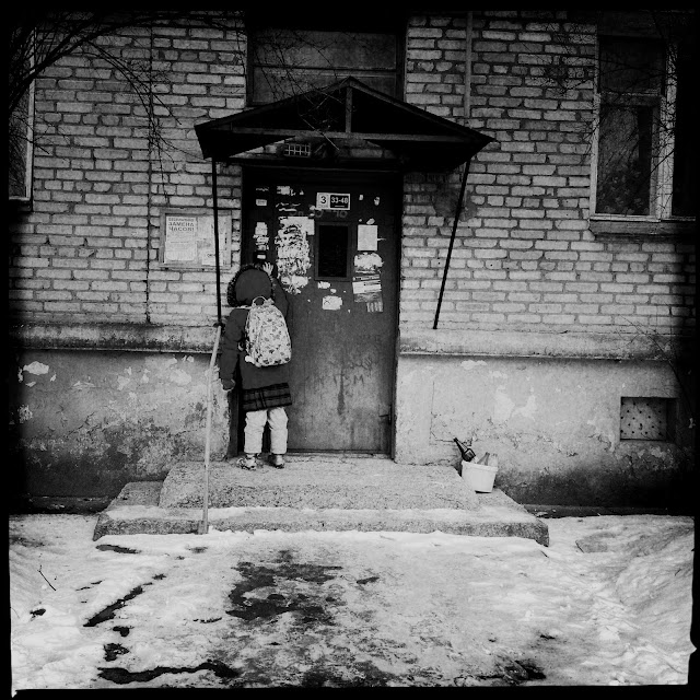 Small schoolgirl going to home - st. Kalinina, Minsk, Belarus