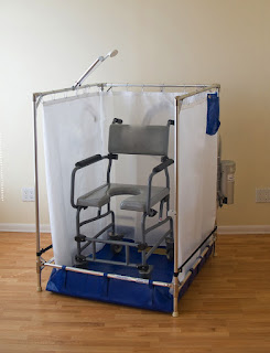 http://www.essenlux.com/products/fold-away-wheelchair-shower-standard-model