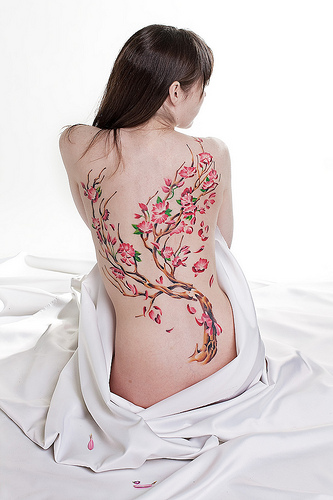For a woman with strong values a cherry blossom tattoo may well be the 