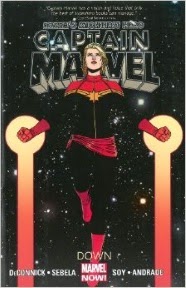 Cover art for Captain Marvel by Kelly Sue Deconnick, featuring a pale-skinned blonde woman in vertical flight.