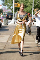 Doutzen Kroes -wearing a gold dress