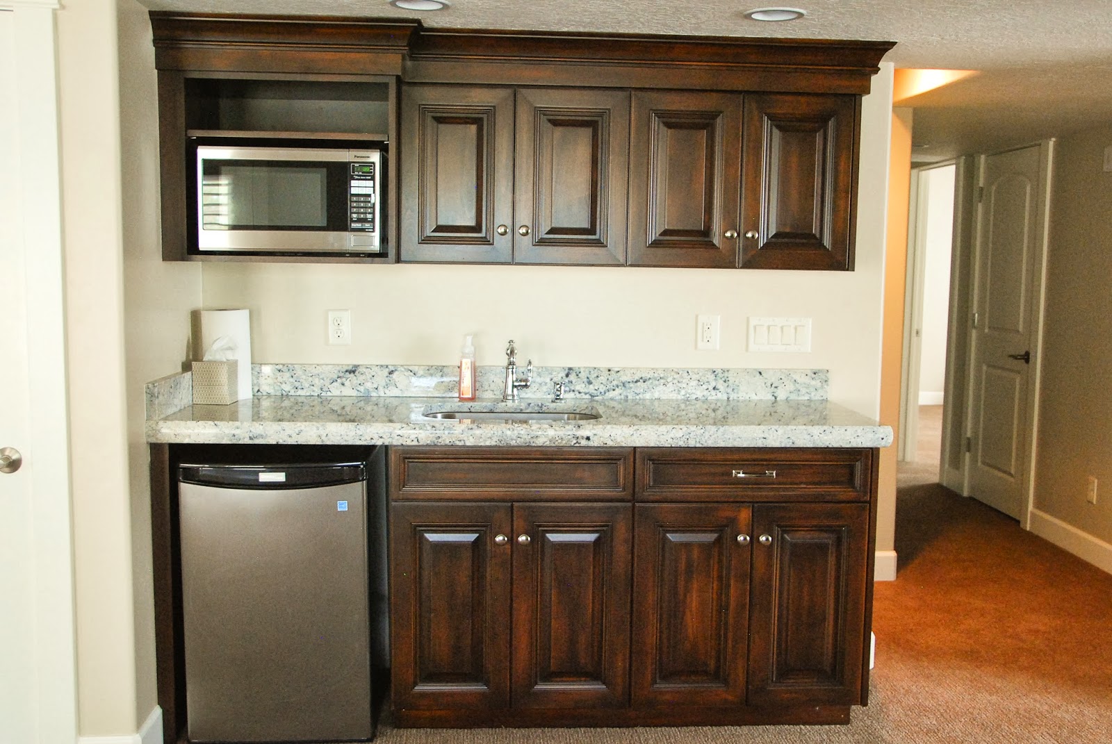 The Granite Gurus Bianco Romano Wet Bar & Vanities from MGS by Design