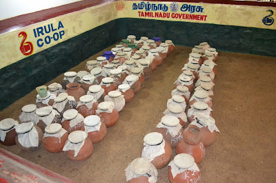 Earthen pots containing snakes