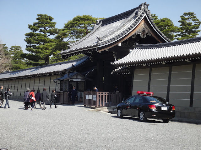 Queuing up and waiting for the guided tour by the Imperial Household Agency at the main entrance of Kyoto Imperial Palace (Kyoto Gosho) in Kyoto, Japan Queuing up and waiting for the guided tour by the Imperial Household Agency at the main entrance of Kyoto Imperial Palace (Kyoto Gosho) in Kyoto, Japan