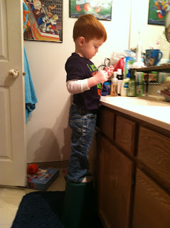 James standing at the bathroom sink