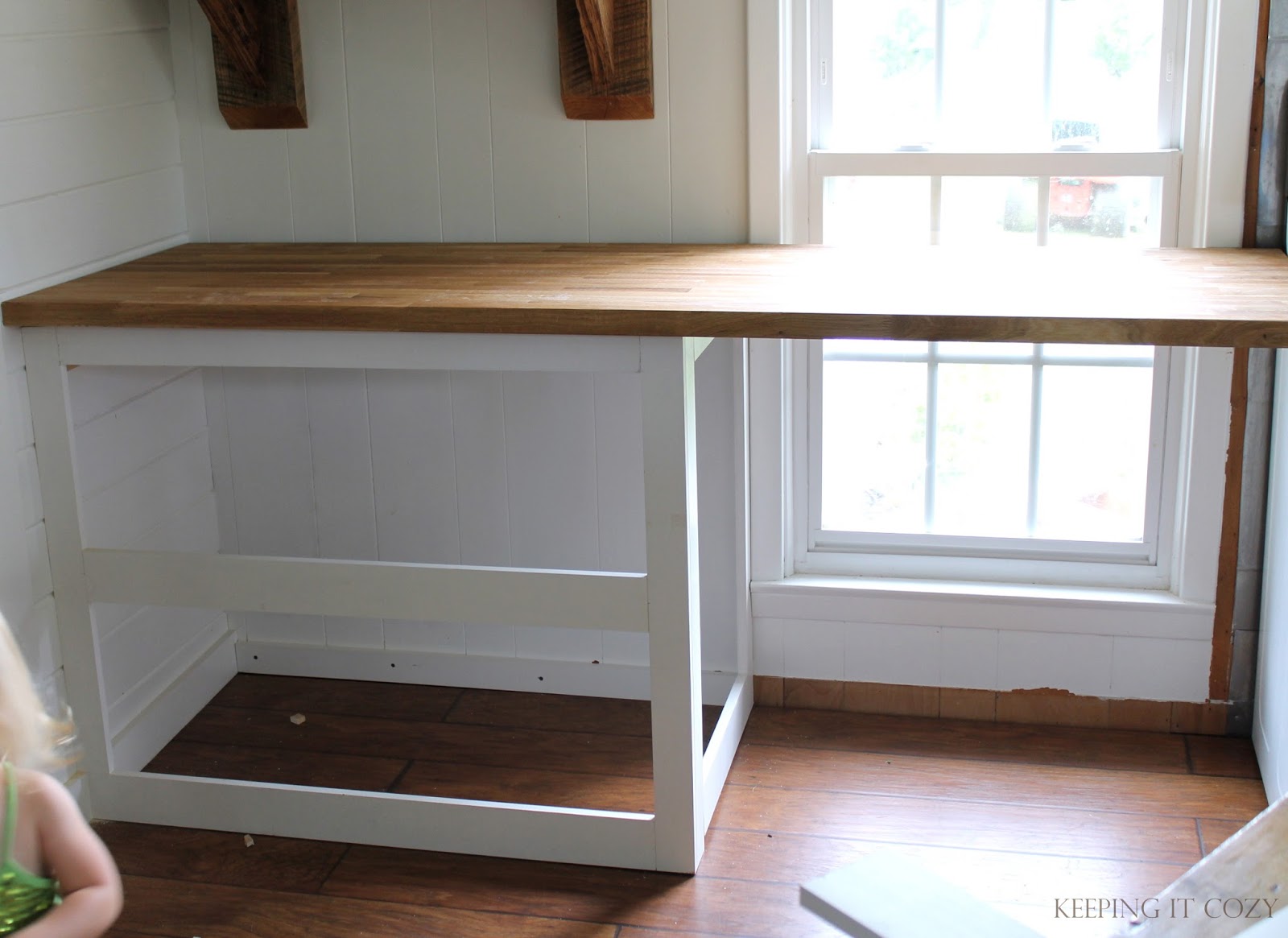 Justus started by framing in the new cabinetry. He used a kreg jig to ...