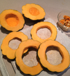 Image of acorn squash cut into 4 rings and ends. 