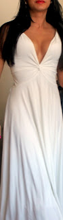Brunette blogger in white plunging neckline dress