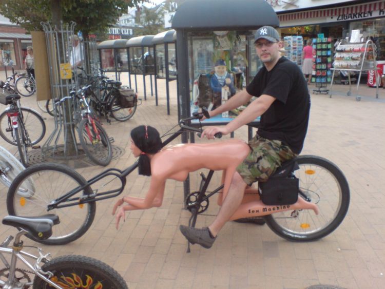 man+with+doggie+style+bike+having+sex+with+woman+dr+heckle+funny+photo+blog.jpg