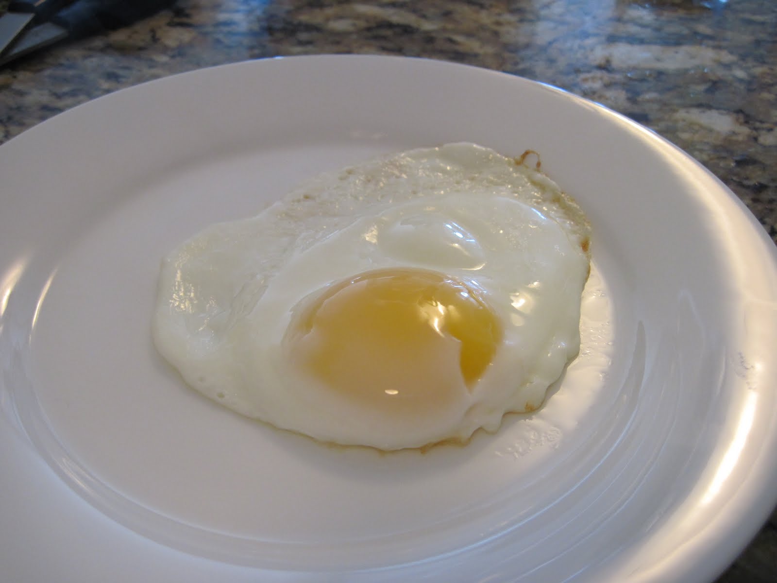 How many calories are in one fried egg?