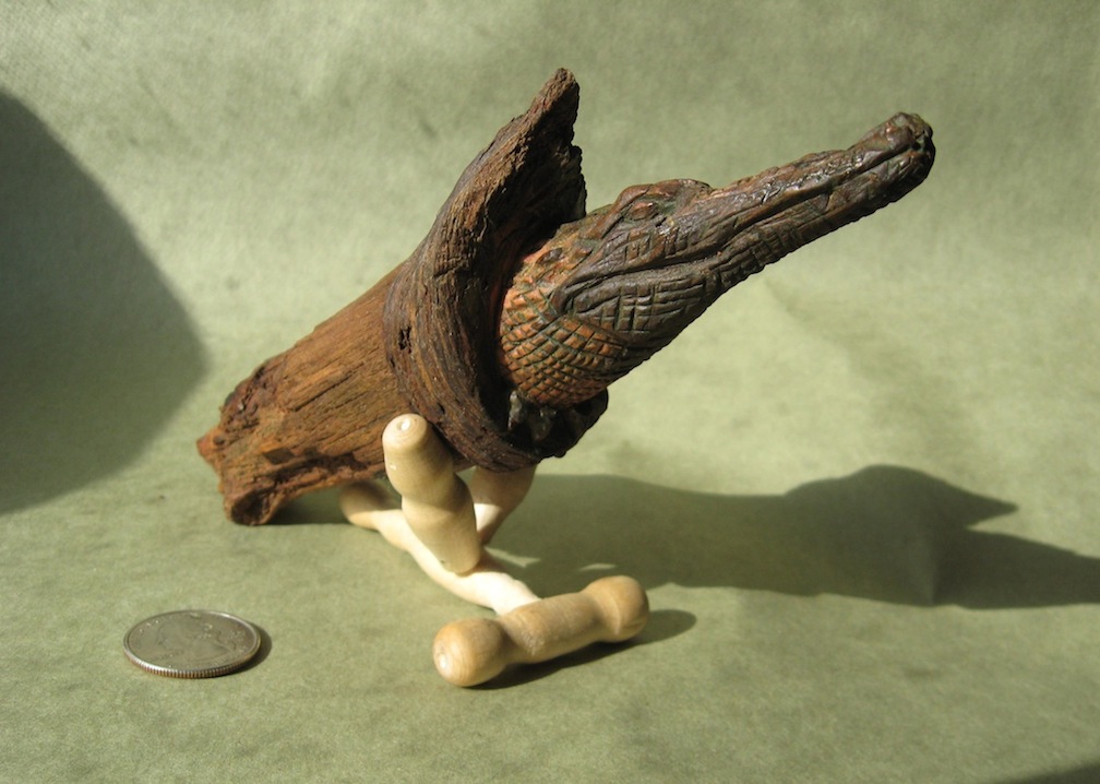 'Croc Knot' wood carving in pine knot and custom turned stand