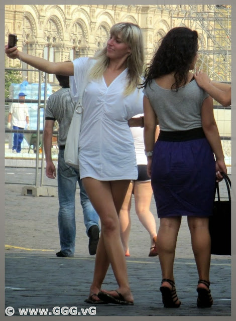 Blonde girl in white shirt on the street