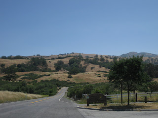 Mt. Hamilton Road climbing past entrance to Joseph D. Grant County Park, with Lick Observatory in the distance