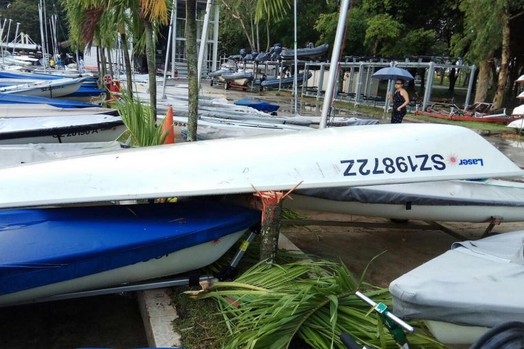 An overturned boat is seen at East Coast Park after unusually strong winds hit the area, on Jan 31, 2018.