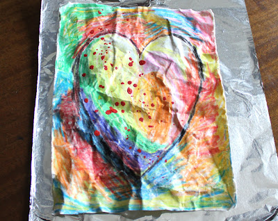 paper batik instruction drawing of a multi colored heart