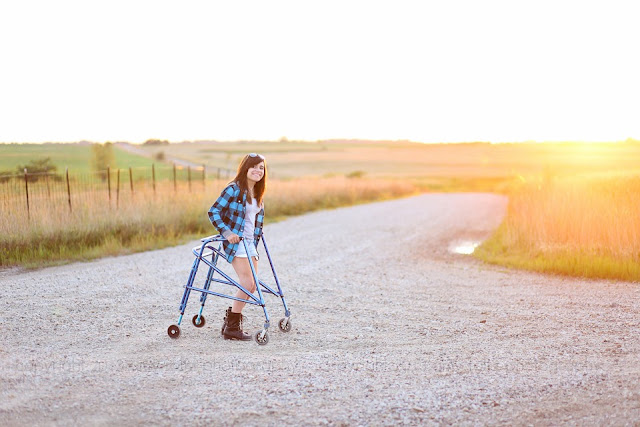 photo of a senior girl with a walker on a country road