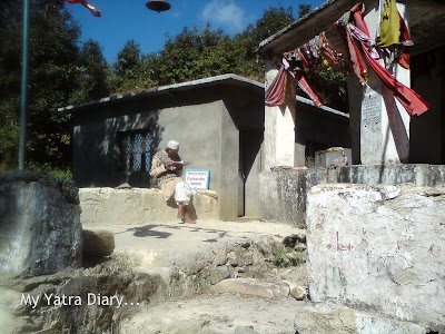 A man immersed in  reading a holy book at Kemundakhal, enroute to Badrinath