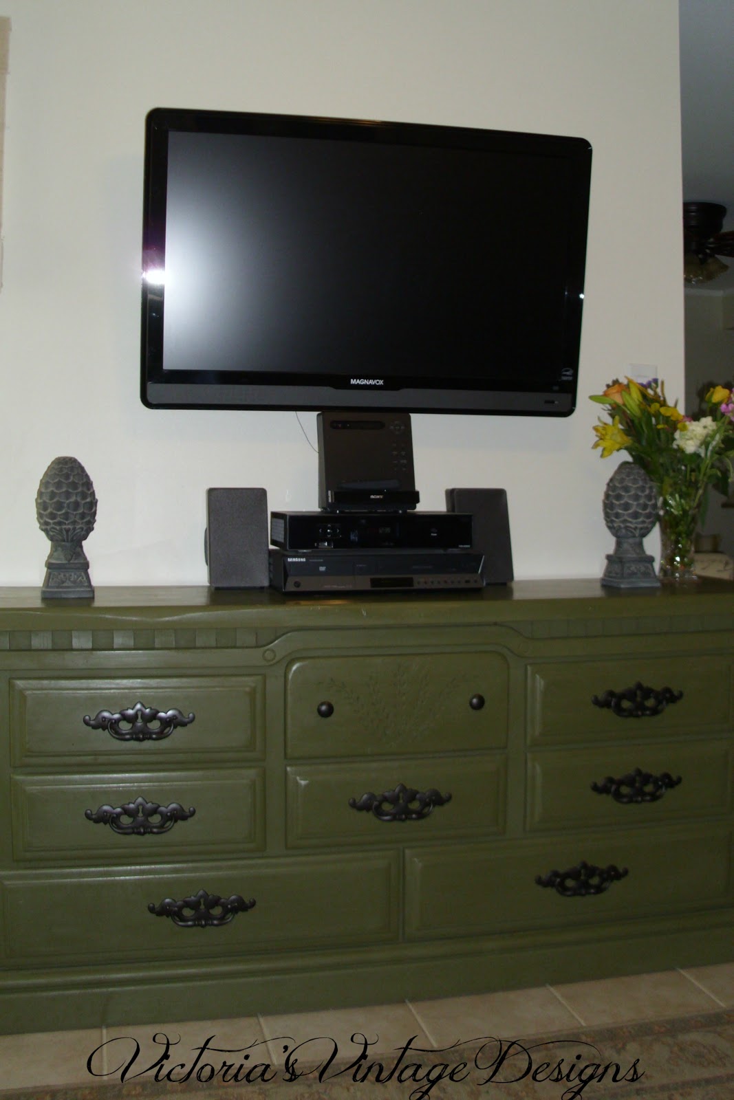 Kitchen cabinet towel bar This is an old dresser that I repurposed as a media cabiin my den.