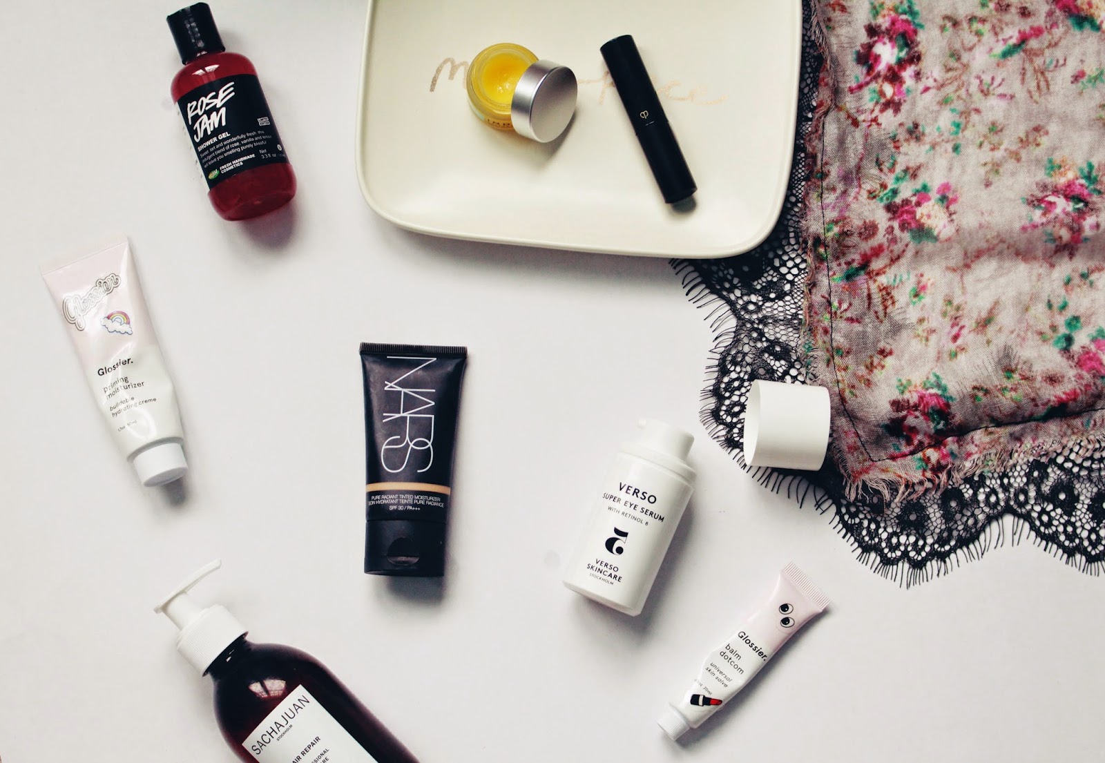 january favorites lush rose jam, glossier balm dotcom, verso super eye serum, cle de peau concealer, indie lee calendula balm, nars tinted moisturizer, glossier priming moisturizer, sachajuan hair repair