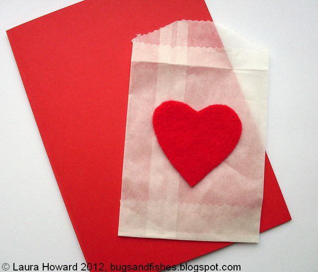 Stick the heart onto the front of a mini glassine envelope using 
